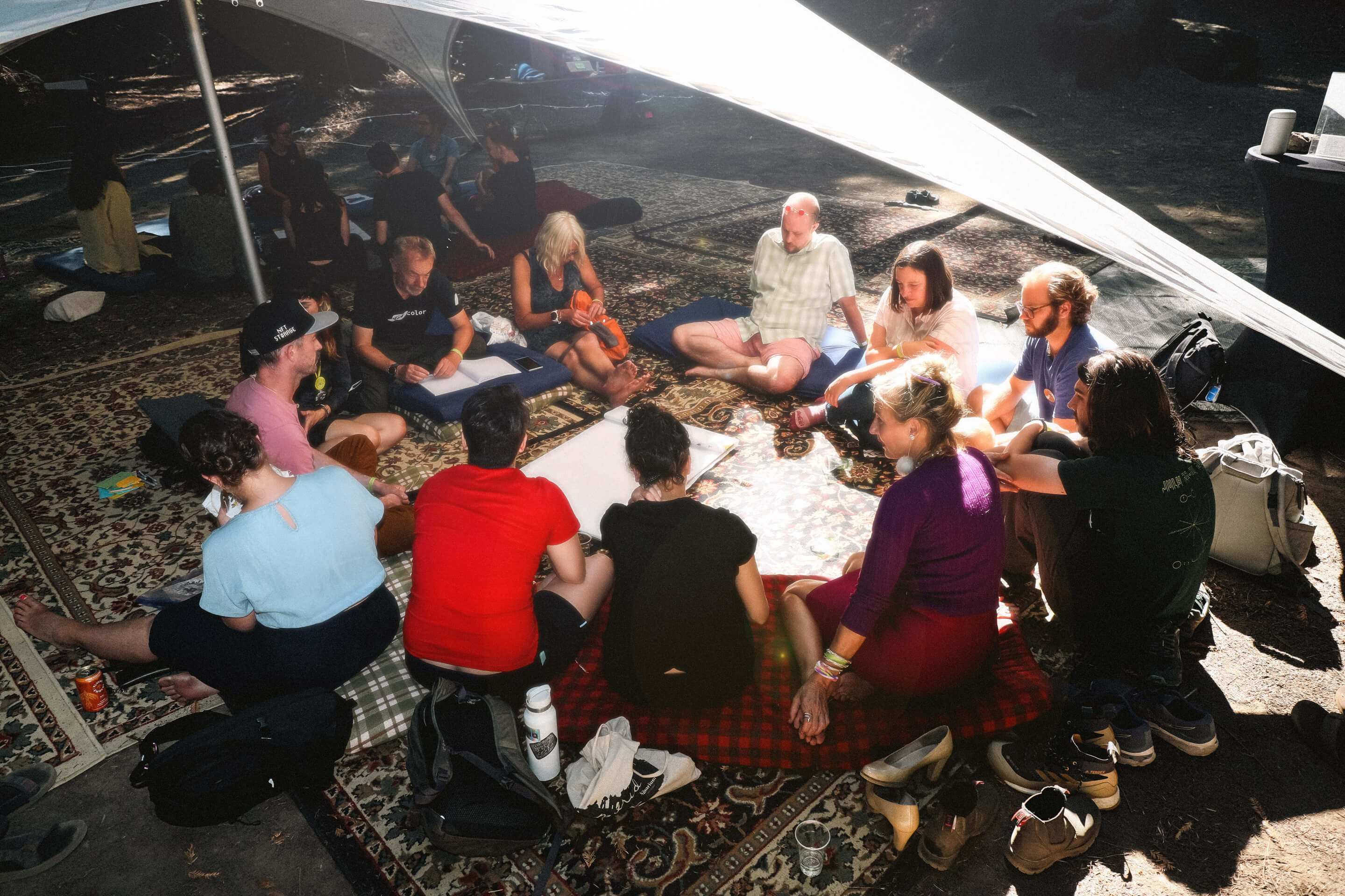 People sitting under the tea tent